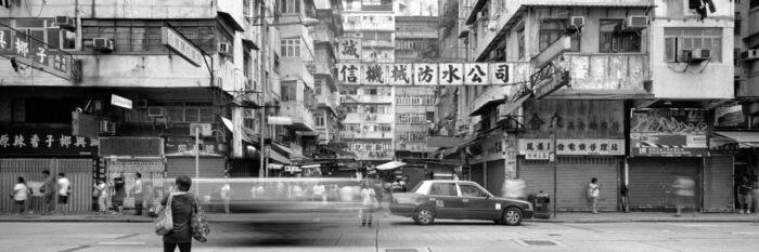 black and white street scene in mong kok hong kong