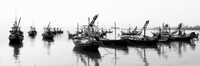 Fishing boats moored in thailand in black and white