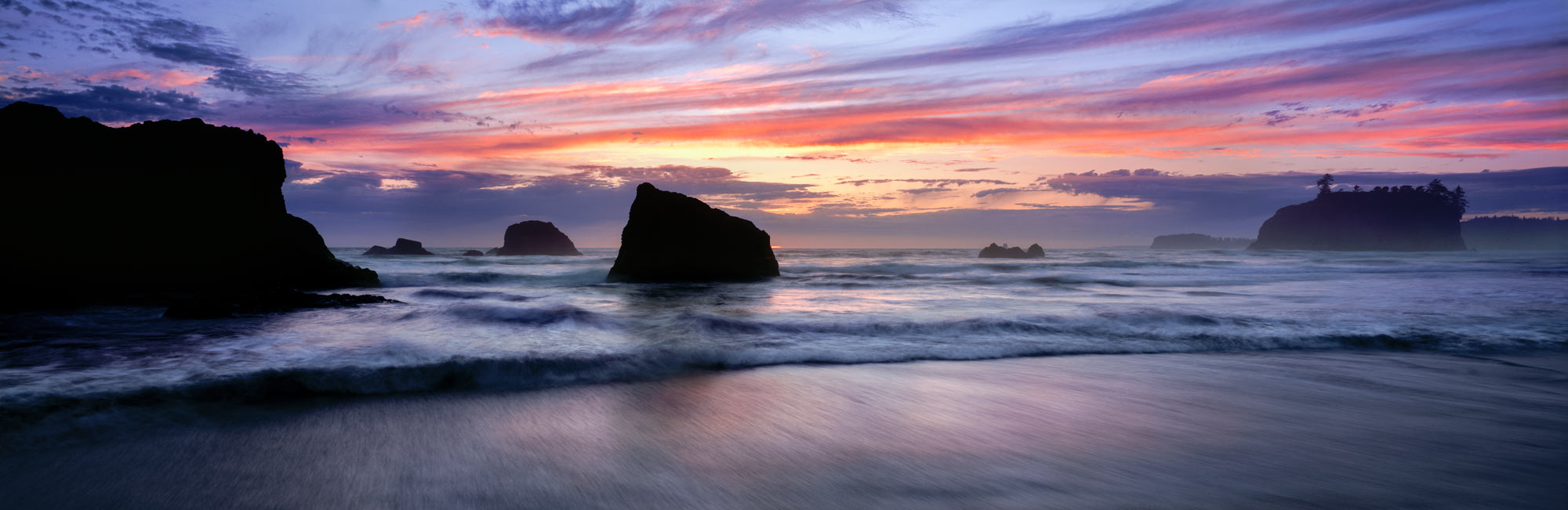 Beautiful sunset on ruby beach between the huge rocks