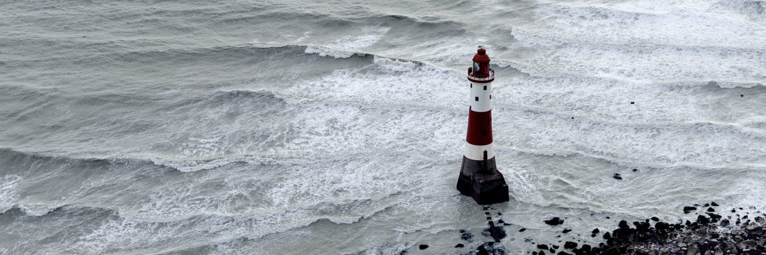 England lighthouse amongst stormy waves