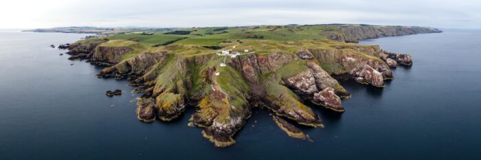 Scottish rugged coast and lighthouse