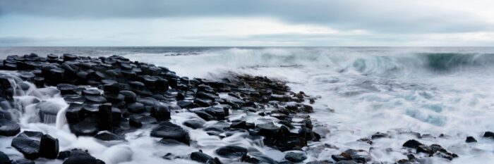 a panoramic print of the giant's causeway on a stormy day