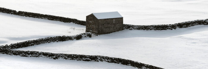 Yorkshire Dales barn covered in snow panoramic