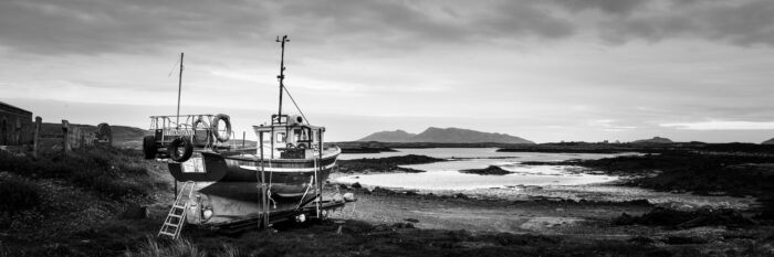 Fishing boat on the shores of a scottish lake b&w