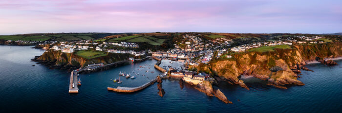 Aerial Panorama of Mevagissey harbour fishing village in Cornwall on the southwest coast path