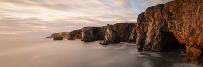 Panorama of the Pembrokeshire coast at sunset at stack rocks and castlemartin