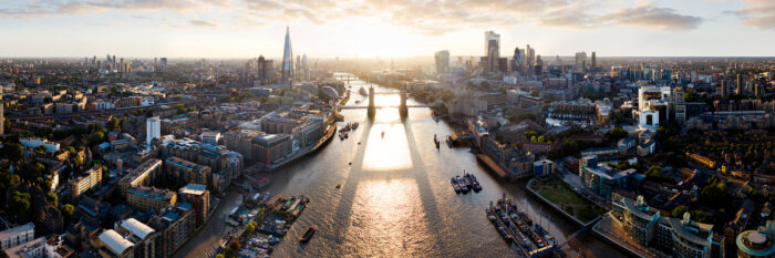 Aerial Panorama of the Tower bridge and the London Skyline at sunset