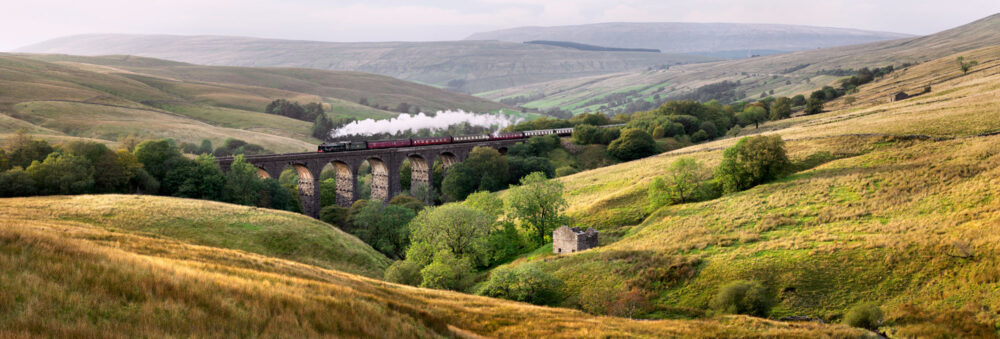 Panoramic photo print of the Dalesman steam train crossing the dent head viaduct in the Yorkshire Dales England