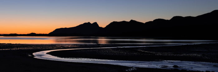 Panorama of the midnight glow in the Arctic Circle in Norway