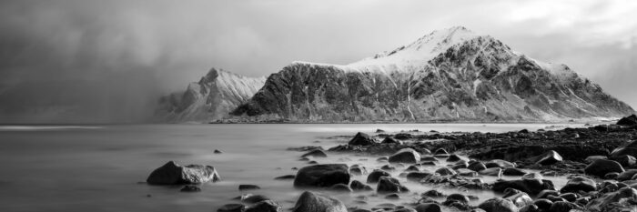 Monochrome panorama of Hustinden mountain and beach in the Lofoten Islands