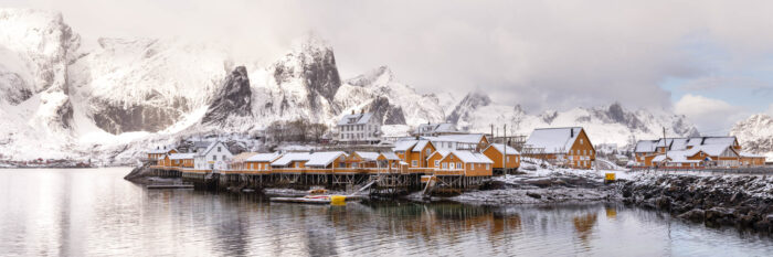 Panorama of the Sakrisoy yellow fishing village and cabins in the Lofoten Islands in winter