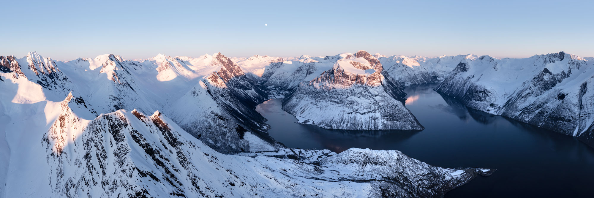 Panorama of Hjorundfjord and Smorskretindane mountains in winter in Norway