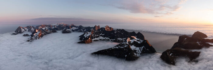 Aerial panorama of the wall of Lofoten during a cloud inversion