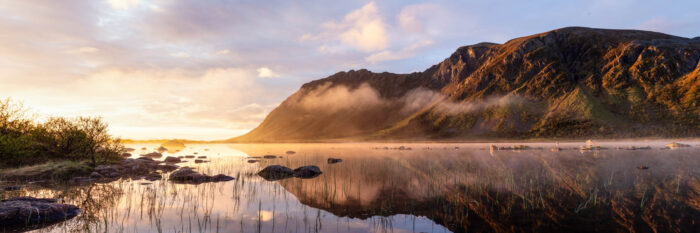 Panorama of a lake in the Gimsøymyrene nature reserve on Gimsøy Island in the Lofoten Islands in Norway
