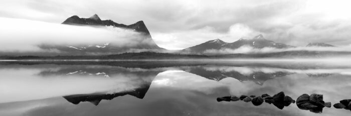 Black and white panorama of Vallentinden mountains along the Efjorden in Norland, Norway