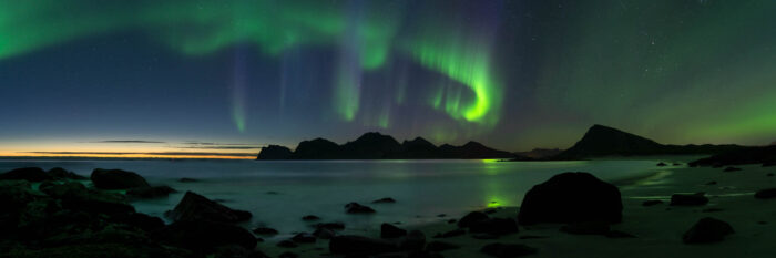 Panorama of the Aurora over a beach in the Lofoten Islands