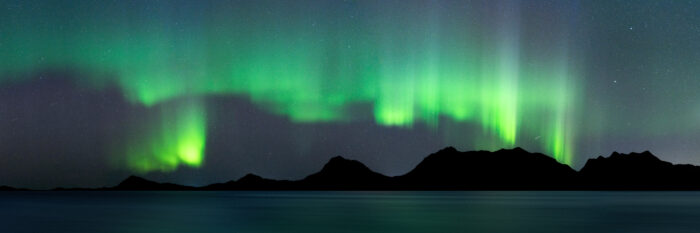 Panorama of the Northern Lights over Tjongsfjorden in Nordland Norway