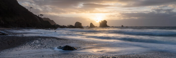 Panorama of Playa de Silencio at sunset in Asturias Spain