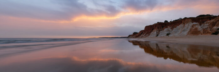 Panorama of the Praia da Falésia at sunset in the Algarve, Portugal.