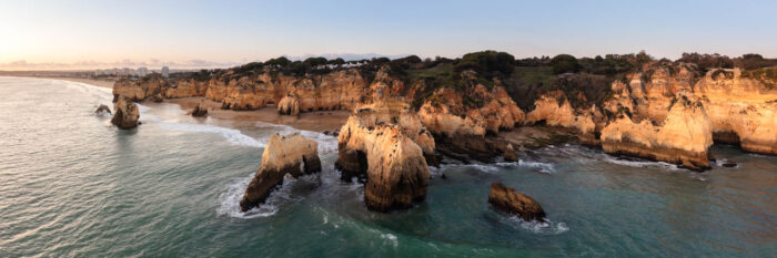 Aerial Panorama of Prainha Beach at sunset in the Algarve Portugal