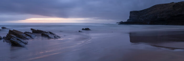 Panorama of Zambujeira do Mar beach at sunset in Portugal