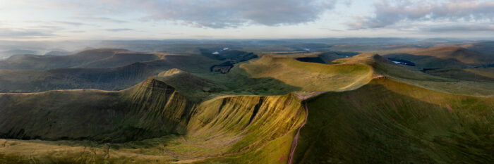 Aerial Panorama of the Brecon Beacons Bannau Brycheiniog at sunrise in Wales