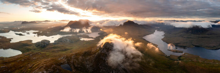 Aerial Panorama of Assynt mountains and Lochs at sunrise in Scotland