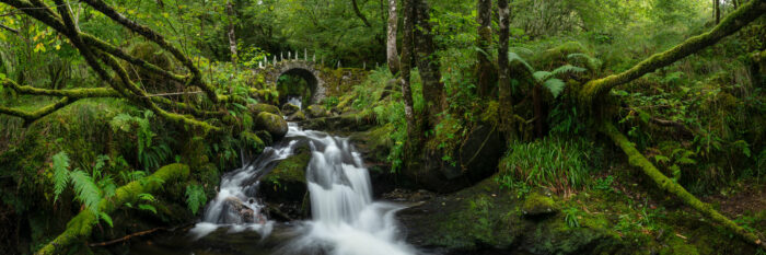 Panorama of a Fairy Bridge over a waterfall in Glen Creran in Scotland