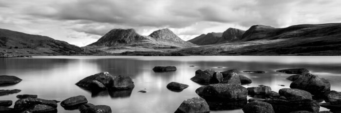 Black and white panorama of Loch Bad a Ghaill and Sgorr Tuath Mountain in Assent in Black and White
