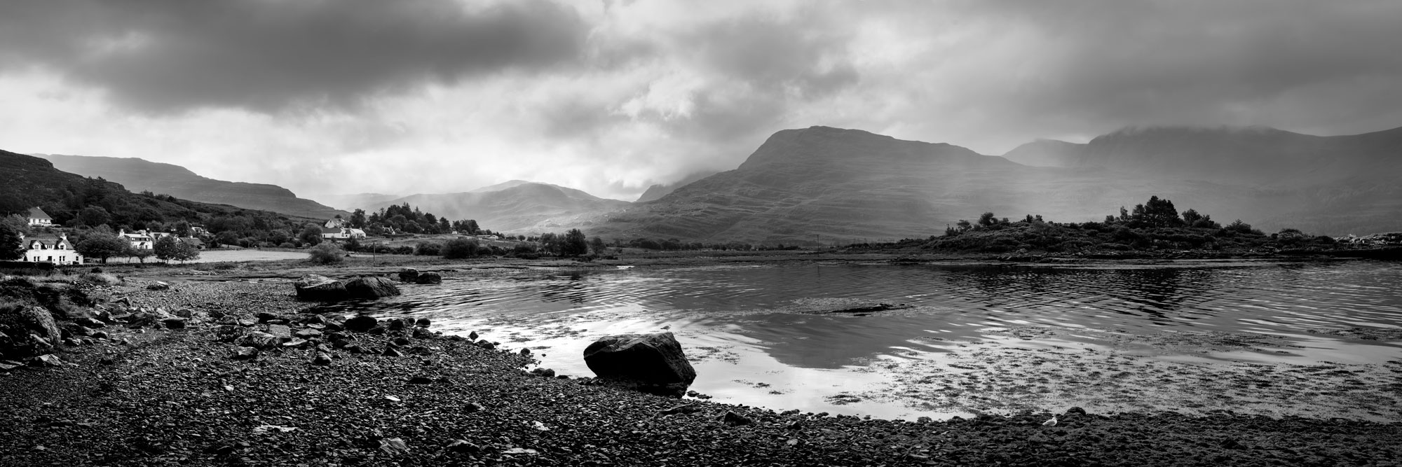 Black and white panorama of Torridon Village and Loch in the Scottish Highlands