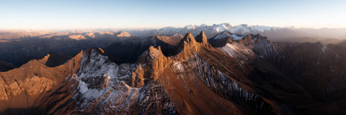 Aerial panorama of the Aiguilles d'Arves mountains in the French Alps at sunset