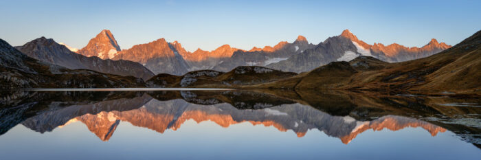 Panorama of the Mont Blanc Massif reflecting in Lacs de Fenêtre in Switzerland