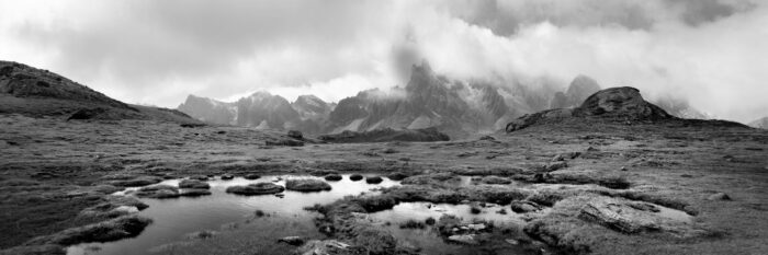 Black and white panorama of ponds below the Massif des Cerces in the Vallée de la Clarée Highlands in the Alps, France