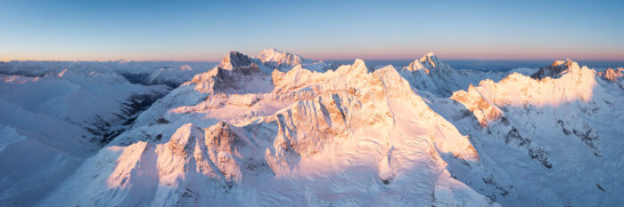 Aerial Panorama of the Mont Dolent Tripoint on the Mont Blanc Massif in winter at sunrise, Swiss Alps