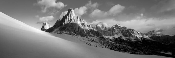 B&W Panorama of Snowy hills of Passo Giau and Ra Gusela Mountain in Winter in the Italian Dolomites