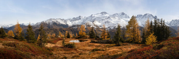 Panorama of Autumn colours along the Six Jeurs hiking route in Lac d'Emosson Switzerland