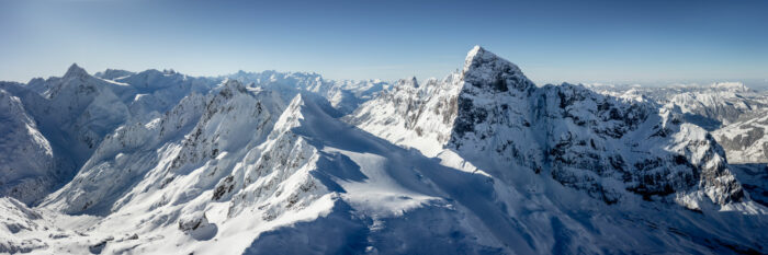 Aerial Panorama of Titlis mountain covered in snow in winter in Engelberg, Swiss Alps.