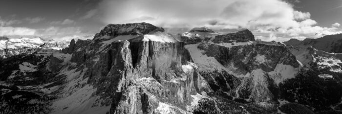 Monochrome aerial panorama of the Sella Mountain Range at Sella Pass in the Dolomites, Italy