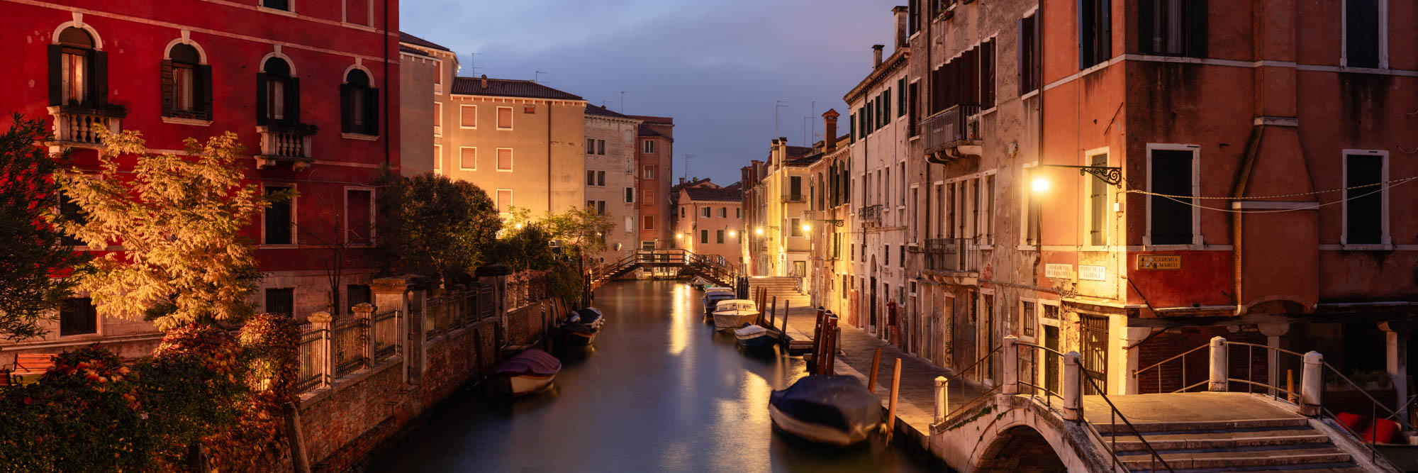 Panorama of a quiet canal in Venice at night in Italy