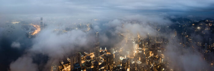 Aerial Panorama above the clouds of Hong Kong at dawn