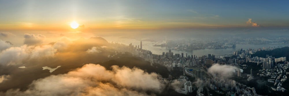 Aerial panorama above the clouds at sunset in Hong Kong