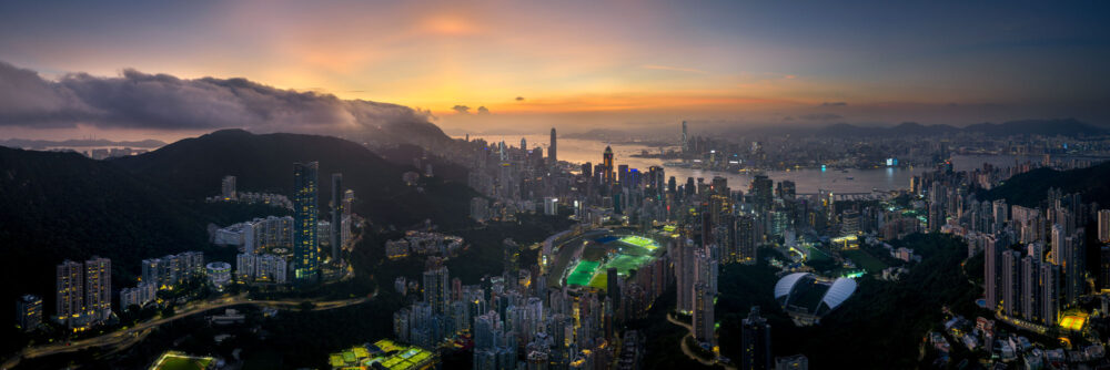 Aerial panorama spirant of Happy Valley at sunset in Hong Kong