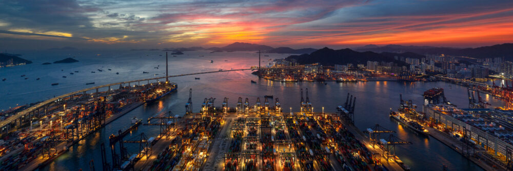 Aerial panoramic view of the Kwai Ching and Kwai Tsing container port terminals in Hong Kong at sunset