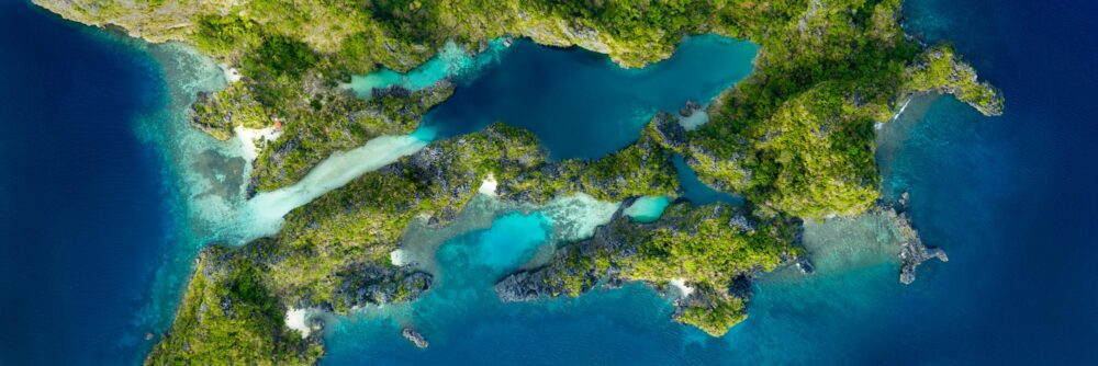 Aerial above the Big and Small Lagoons on Miniloc Island in Bacuit Bay, Palawan, Philippines