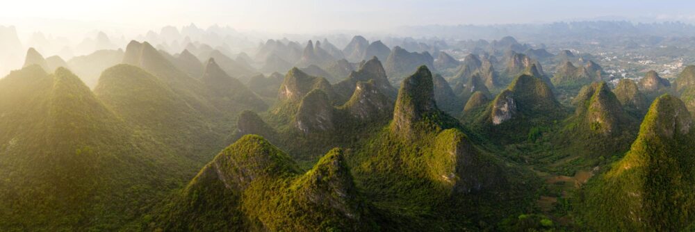 Aerial panorama of the green mountains and valleys of Yangshuo in Guilin China