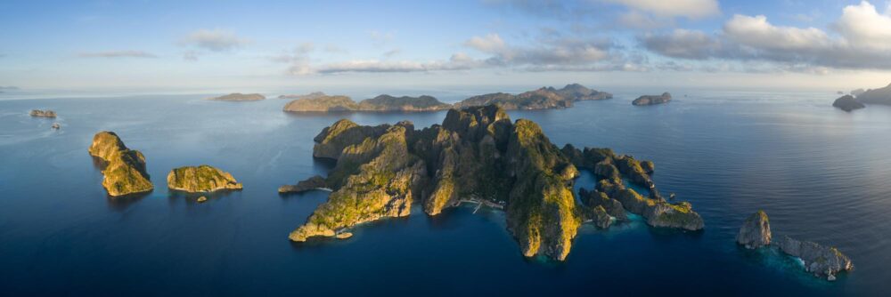 Aerial Panorama of Miniloc Island during golden hour in Bacuit Bay, Palawan, Philippines