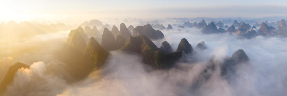 Aerial panorama of a sea of clouds in the Yulong River Valley in Yangshuo China