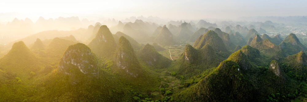 Aerial panorama of the green mountains and valleys of Yangshuo in Guilin China