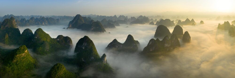 Aerial panorama of a sea of clouds above the River Li in Xingping Yangshuo China at sunrise