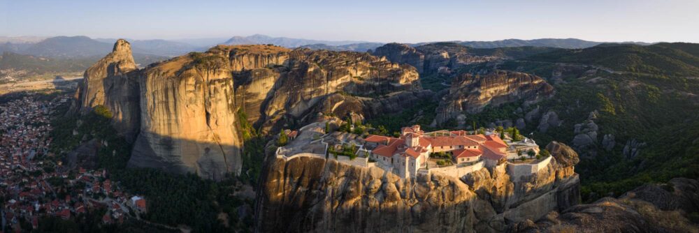 Aerial Panoramic print of the Hoy Trinity Monastery in the Meteora, Kalabaka, Greece during golden hour